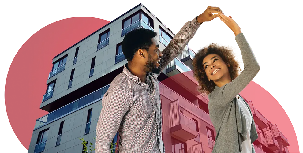 couple dancing with building behind them