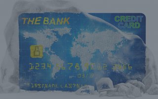 A bank credit covered in ice.