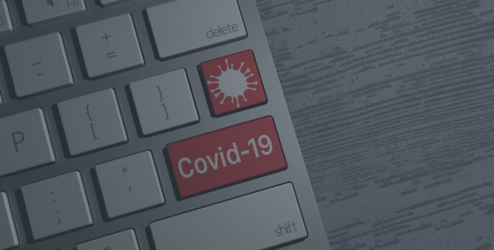 A keyboard with a red covid-19 key.