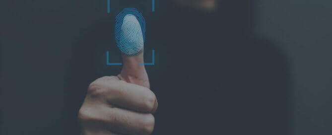 A thumb pressing a blue screen