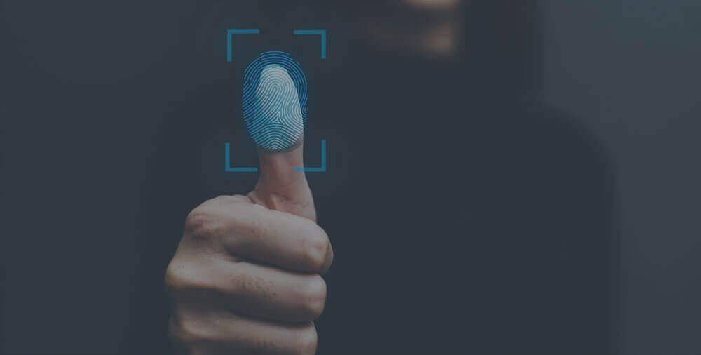 A thumb pressing a blue screen