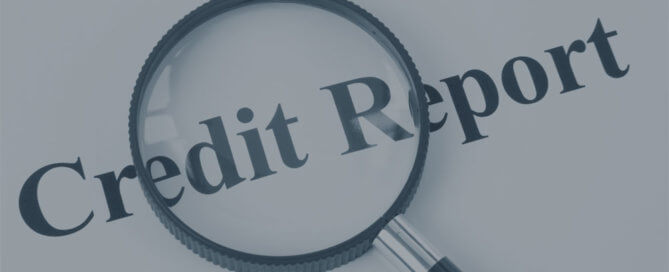 A paper that says "credit report" with a magnifying glass.