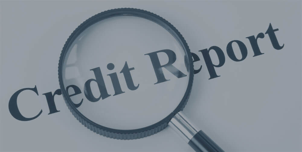 A paper that says "credit report" with a magnifying glass.