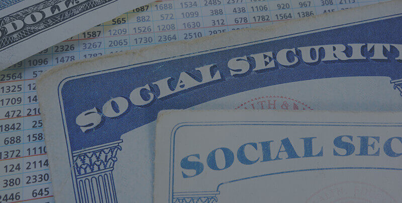 Two paper social security cards.