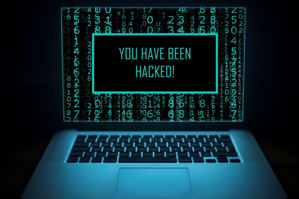 A computer with a screen that says "you have been hacked!"
