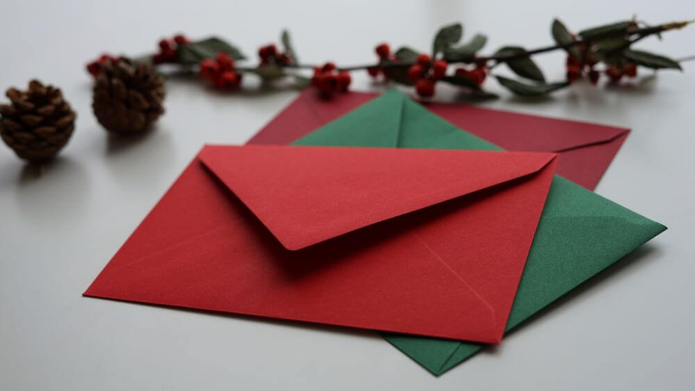 Letters and envelopes with festive decorations.