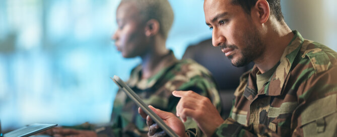 military member looking at tablet