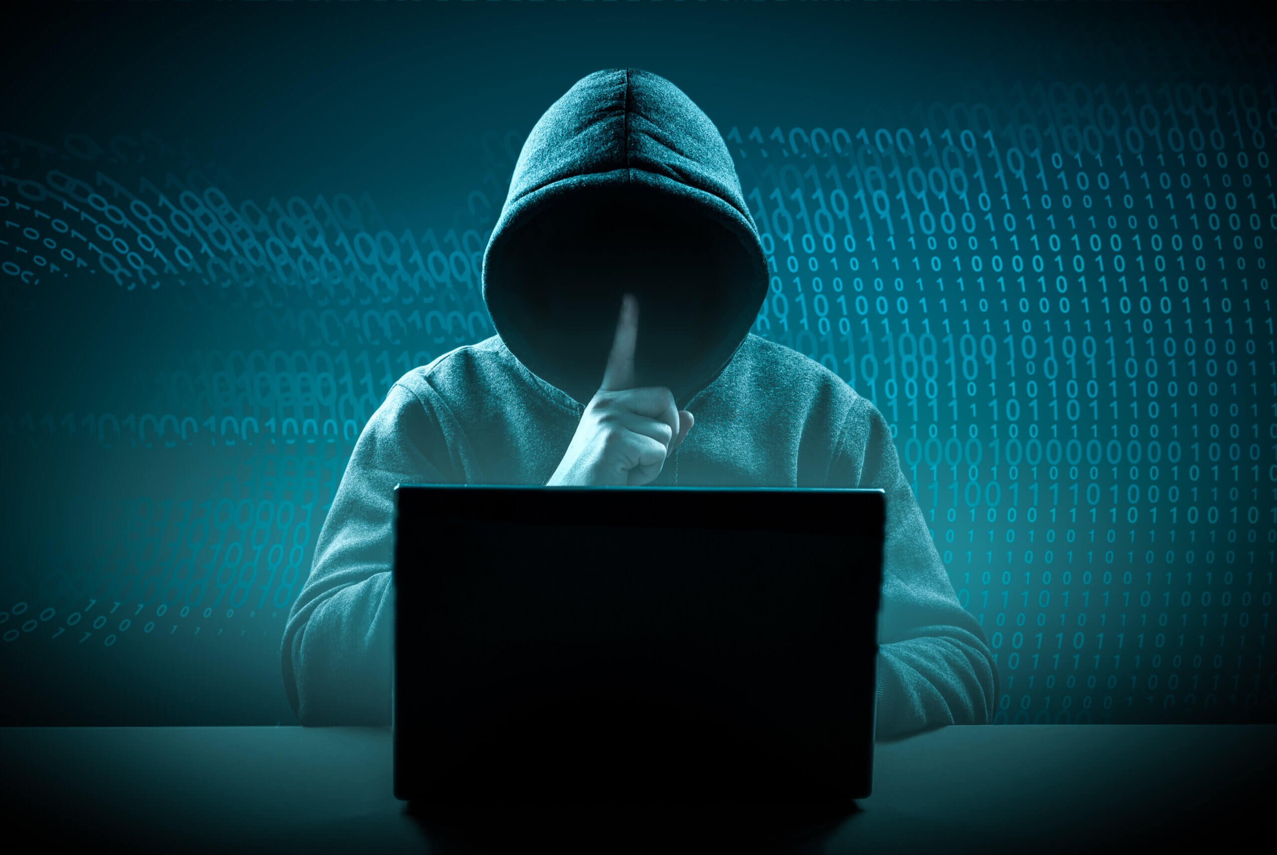 Cybersecurity, computer hacker with hoodie.